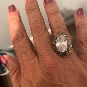 Sterling silver with large white sparkling stone. Stunning!